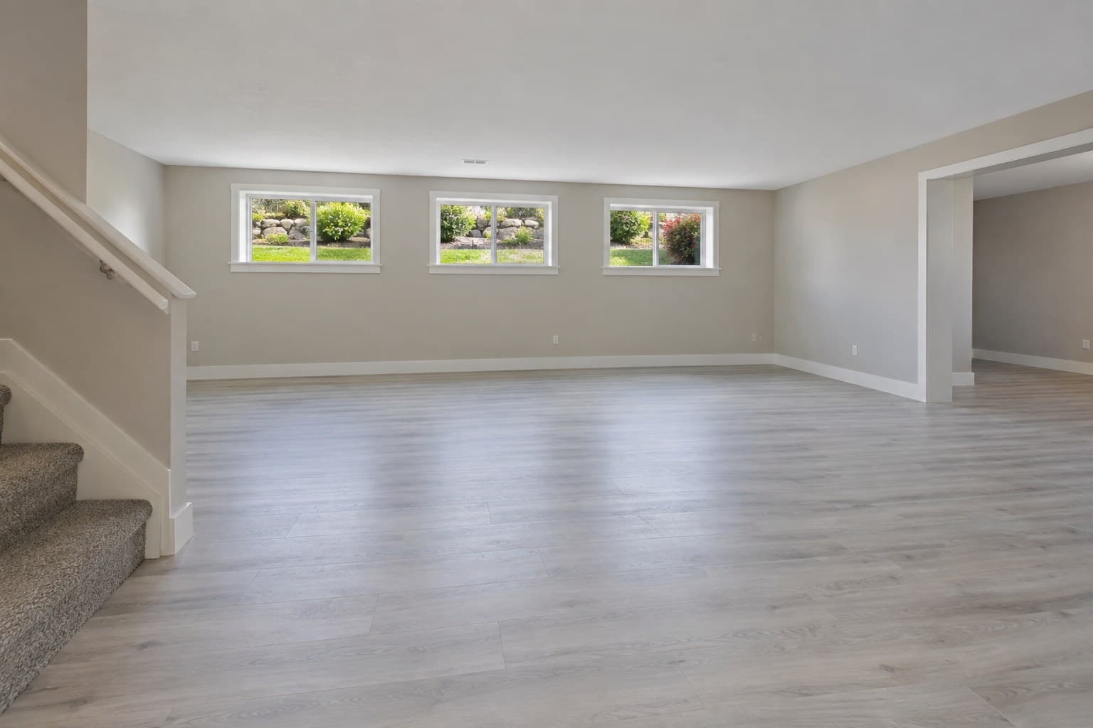 Original image: Empty basement rec room, furnished
